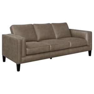this charming transitional sofa makes itself at home in mid-century modern and minimalist style living rooms effortlessly. A tailored tuxedo style frame with double track arms is upholstered in a neutral vintage brown leatherette that offers a soft