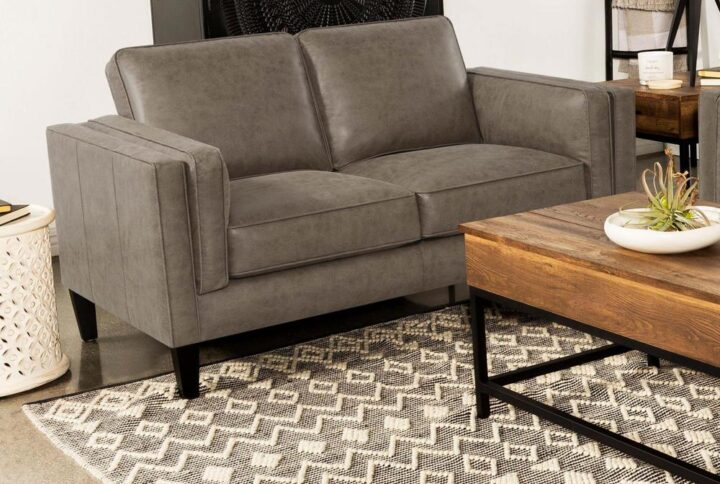 Create extra seating in your mid-century modern living room with this minimalist-inspired contemporary loveseat