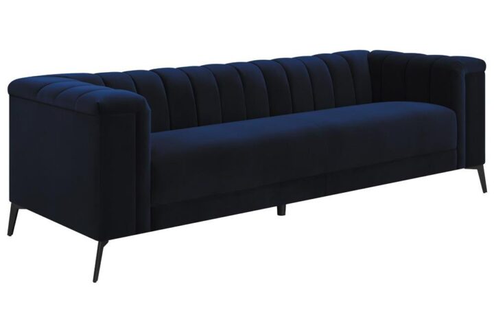 This magnificent transitional sofa will bring a dynamic radiance to your living space. It's upholstered in a stunning navy blue matte velvet fabric that you have to see to believe. Whether you sit or lie down