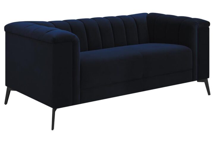This elegant transitional loveseat will bring a palpable radiance to your home. It's upholstered in a vibrant navy blue matte velvet fabric that's so soft and stunning that you'll have to experience it to believe it. Whether you recline or sit