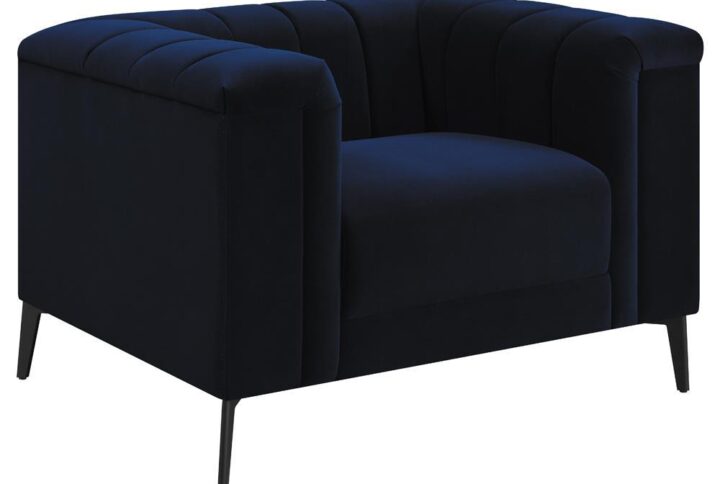 A sumptuous transitional accent chair will be a vibrant addition to your home. You'll love the stunning navy blue matte velvet fabric upholstery for its softness and visual appeal. The bench-style seat with pocket coil springs will offer the perfect comfort and support for your needs. Deep vertical channels highlight the shelter back and inside arms. Tapered black metal legs put the finishing touches on this vibrant chair that will become a family favorite.