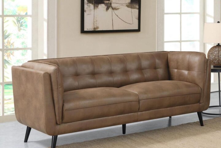 Elevate your mid-century modern living room seating area with this contemporary Chesterfield shelter style sofa