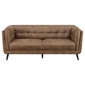 featuring plush grid tufted backrests and cushions upholstered in a soft brown performance coated microfiber for supreme comfort. This retro-inspired contemporary upholstered living room collection presents classic Chesterfield style frames