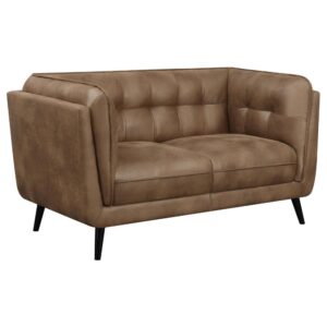 designed as an updated take on the classic Chesterfield style silhouette including grid tufted seats and backs along with welt trim details. Upholstered in a soft and smooth brown microfiber leather
