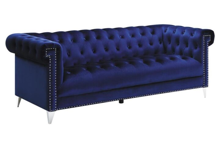 Dazzle and delight your guests with this exceptional blue sofa. Striking blue velvet upholstery steals the spotlight in your living room