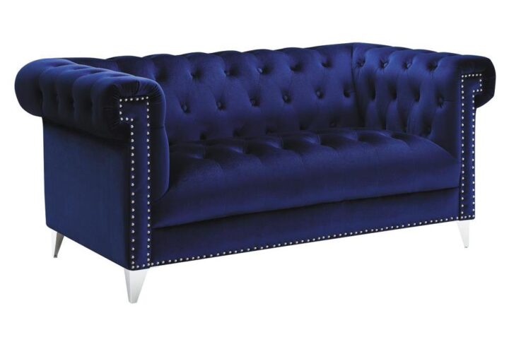 Admire the elegance and allure of this blue loveseat. Upholstered in a sensationally soft velvet