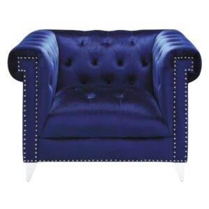 A bold blue armchair brings admiration from all guests. Enticingly soft velvet fabric is brought to life with a button tufted backrest. Extra wide seating provides a plush and comfortable place for reading or relaxing. Nail head trim and tuxedo arms enhance the aesthetics of your new armchair. This piece is supported on tapered chrome legs.