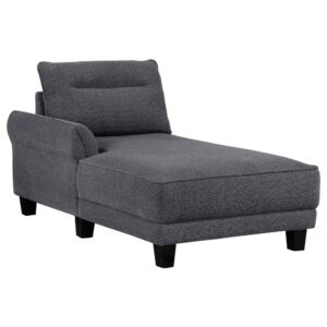 available in grey or white. The fuzzy teddy bear-like textured fabric upholstery creates a cozy atmosphere. The softly rounded arms and welt framed reversible back cushions add a touch of sophistication. With attached welt-accented boxed seats and solid wood tapered legs