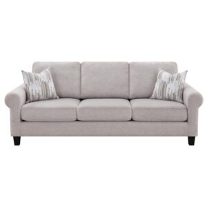 this transitional sofa features several timeless elements for a classic touch. Curl up with a good book or stretch out for a nap between gracefully rolled arms. Wrapped in a soft beige oatmeal chenille upholstery with champagne hue accents