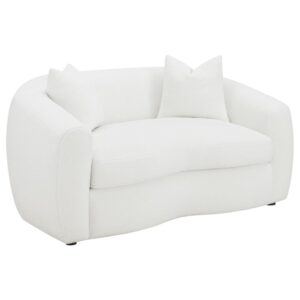 featuring boucle upholstery that presents an inviting cloud-inspired resting place. Gracefully curved armrests