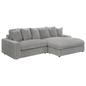 upholstered in a vintage-like wide corduroy performance fabric that offers a soft texture and an elegant fog tone. Each of the two pieces are appointed with reversible seats and back cushions that offer a versatile design