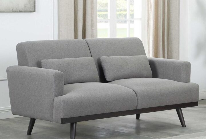 Minimalism becomes a design plus in this modern loveseat with a touch of mid-century modern features. Its simple silhouette and motif are decked out with a waterfall design