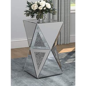 Revel in the eccentric style that is contemporary glam with this side table. Geometric design and unique shape make this a conversation piece. Celebrate the modern style with the architectural appeal. Elegant silver finish presents opportunities for matching with other pieces. Bring this eccentric side table home to stimulate discussion.