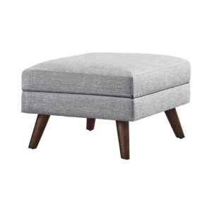 Breathe fresh air into a contemporary space. This stylish ottoman brings a hint of mid-century modern flavor and sweet character. Wrapped in light grey upholstery
