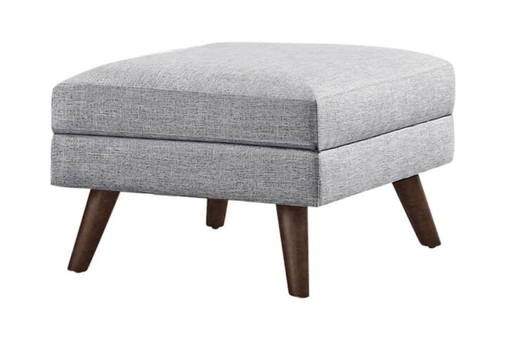 Breathe fresh air into a contemporary space. This stylish ottoman brings a hint of mid-century modern flavor and sweet character. Wrapped in light grey upholstery
