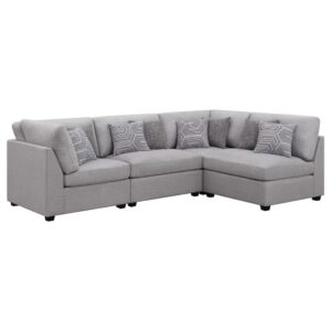 Modular design adds the perfect dose of versatility to a stylish contemporary sectional sofa. Soft gray upholstery is both neutral and on-trend