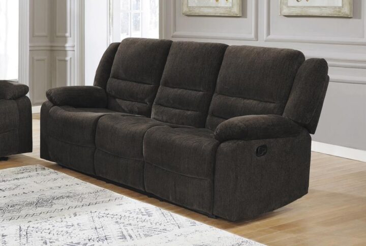 Make guests as comfy as they can be. This motion sofa offers the best of modern engineering and transitional styling. Gorgeous ultra soft chenille in a deep chocolate offers both palette versatility and a dramatic finish. Enjoy triple channeled fiber filled back cushions with extra support and comfort