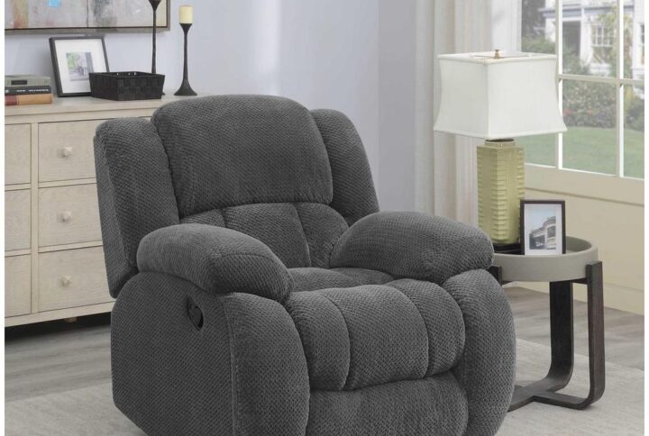 Simplify living room decor with this charcoal glider recliner. Upholstered in soft fabric