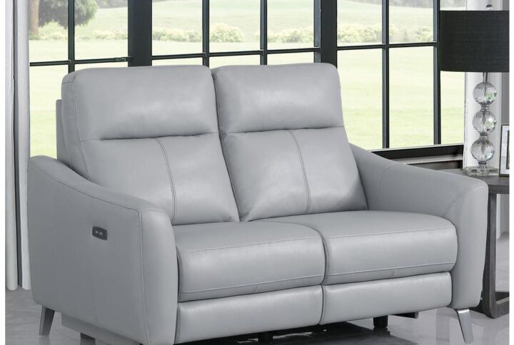 Trending gray leatherette upholstery spells an aesthetical boost to this modern two-seat power loveseat. This loveseat is operated by power controls