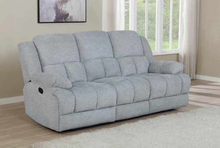 Movie night just got better with this motion sofa. Your new manual reclining sofa allows you to sit back and unwind no matter the time of day. Exceptional comfort is offered with the perfectly plush backrest and cushioning. Overstuffed armrests make for an ideal place for relaxing at the end of the day. Use this piece in a home theater room or modern living space.