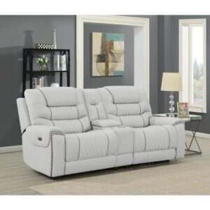 Feel a powerful impact in your living space with this dual power loveseat. Both seats recline at the touch of a button for a comfortable seating experience. Two cup holders are available for keeping beverages on hand. All guests will admire the aesthetic details of this piece including hand-applied nailhead trim along the armrests. Finally