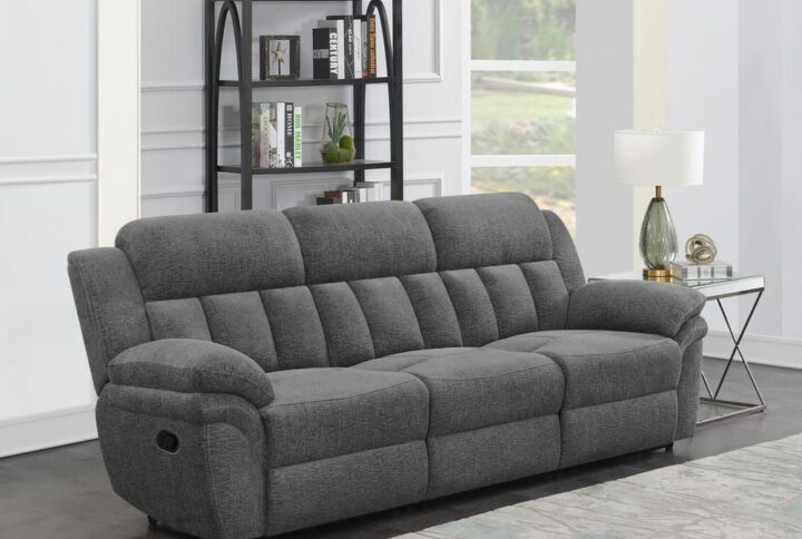 Design a living room built for comfort and relaxation around this transitional reclining sofa. Offering dual recliners operated with a side pull lever