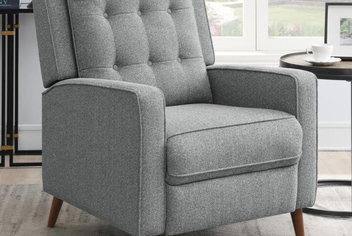 Create a corner retreat with this mid-century modern push back recliner. Designed with a soft gray woven fabric