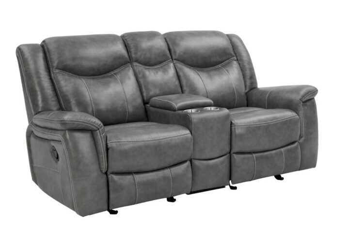 Grey is no longer drab and dreary and this decadent motion loveseat is proof. The angled seat backs feature extra padded headrests for optimal comfort. Padded armrests and recliner leg rest offer extra indulgence. Center console includes amenities like two cup holders and storage space. This loveseat comes wrapped in cool grey leather-like upholstery for a modern appeal.