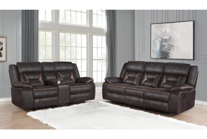 Bring friends and family to watch the newest movie with this motion living room set. Pocket coil seating makes for an incredible seating experience along with padded armrests. Guests can keep drinks on hand by using the built-in cupholders. Find a convenient storage space for reading materials inside a pocket behind the drop-down table. This living room set with consoles keeps your living area organized and stylish.