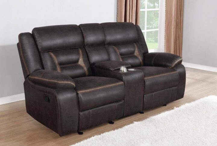 Every entertainment area deserves this glider loveseat with console. The neutral color palette makes it easy to blend with your decor. Its leatherette upholstery ensures a comfortable seating experience. A center console offers a small storage area for remotes with a lift-top container within. Find an easy place to store drinks with the built-in stainless steel cupholders.