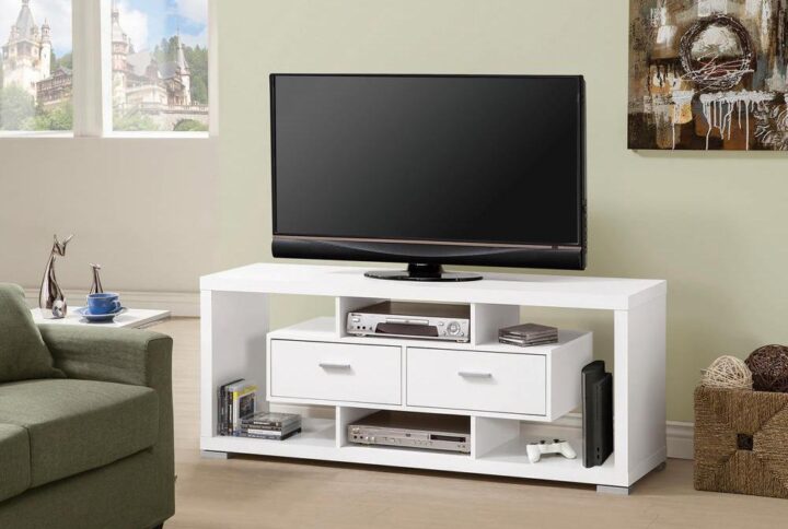 Create a stunning focal point in a bedroom or living room with this modern TV console. Straight lines and angles are sleekened by a clean white finish. Open shelves highlight and suspend two large storage drawers to create an interesting visual. Store remotes and electronics with ease using the matching hardware. Stunning with a vase featuring a fresh flower