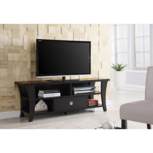 this cappuccino finish television console shows off upgraded design elements. Sleek tapered legs create a sensual silhouette. Open shelving and a single drawer offer visible and hidden storage for media and essentials. Metal hardware adds an ornate finishing touch.