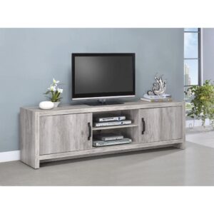 Stylize a modern space with light and airy attitude. Make this TV console a central focus in an entertaining space. A lovely grey driftwood finish reveals a natural grain effect. A spacious surface supports large-screen televisions