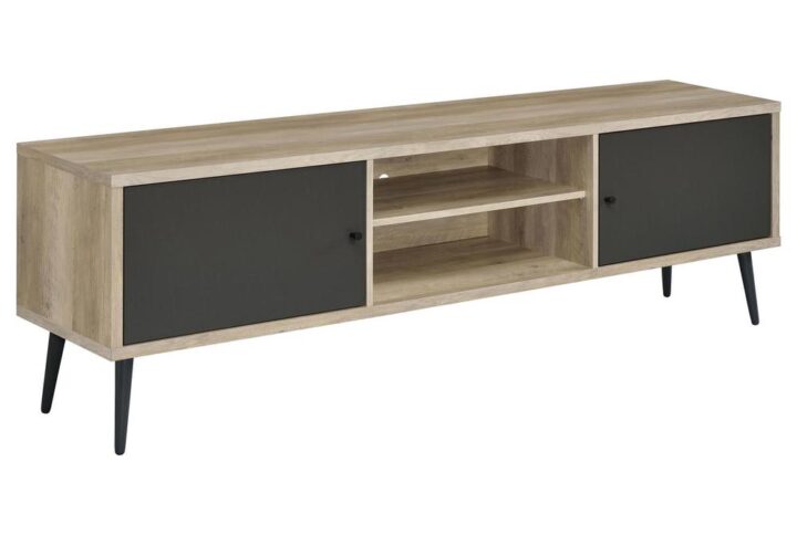 Organize an entertainment space with your stylish taste for Mid-Century Modern style. This TV stand is a sleek mix of old and new with a retro design and neutral palette. Antique pine finish wood products form a rectangular base with two open center compartments and two shelves behind two doors featuring a sleek dark gray finish. Matching dark gray feet emulate retro vibes with a tapered