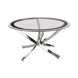sleek design of this coffee table adds casual glamour to any home. Gracefully curved lines of metal crisscross each other pleasingly to form its stylish support. A gorgeous nickel finish enhances its lovely silhouette with a pleasing touch of shine. Its smooth