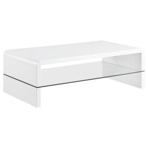 this coffee table boasts an extraordinarily unique silhouette that gives off contemporary vibes. Sandwiched between is a clear tempered glass shelf that lends a utilitarian touch and open