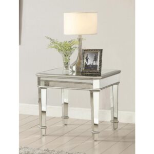 Pour on the glam in a modern space with personality. This end table reflects an ultra-elegant Art Deco motif with linear styling. Gorgeous silver finish enhances the exquisite look of mirrored panels around each edge
