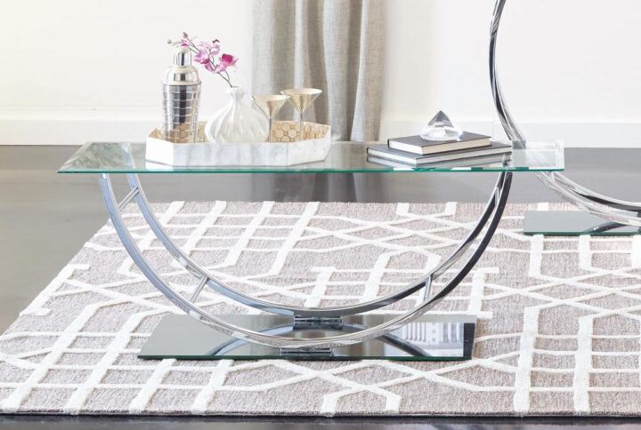 Combine brilliance and innovative design in this contemporary coffee table. The glass rectangular table top is fashioned with beveled edges for a dash of style. The legs are constructed in a U-shaped chrome that's impressive in person. The reflective tempered "half-glass" base completes the table's sleek