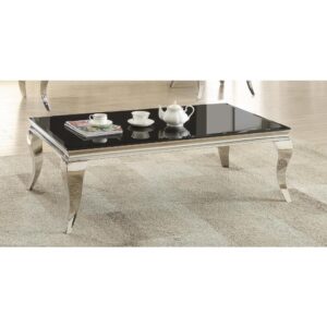 Make a glamourous statement with this modern black coffee table. Its contemporary design is highlighted by crisp lines with a modicum of alluring curves. The classy table top is fashioned in black beveled glass. The curved