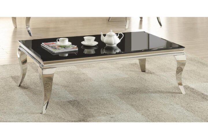 Make a glamourous statement with this modern black coffee table. Its contemporary design is highlighted by crisp lines with a modicum of alluring curves. The classy table top is fashioned in black beveled glass. The curved