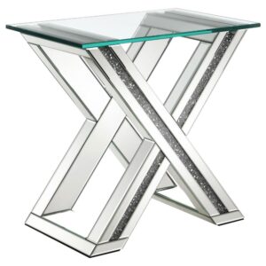 allowing this end table to blend into its surroundings. Tucked within is a silver crushed acrylic center that sparkles elegantly for a luxe look. A clear glass square top offers a smooth surface for resting table lamps and keeping other items near your seating area. Place this sleek contemporary end table next to a sofa or lounge chair to keep lighting and reading material.