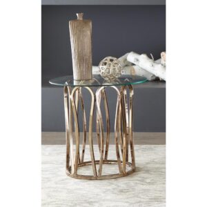 A light and airy ambiance offers elegance and taste. This charming end table plays on an artistic theme and blends beautiful materials. A round glass top perfects the contemporary theme you're after. Enjoy a decorative base with shaped pieces in a warm chocolate chrome finish that capture attention. Add a delightful accent to a modern living area with this tasteful end table.