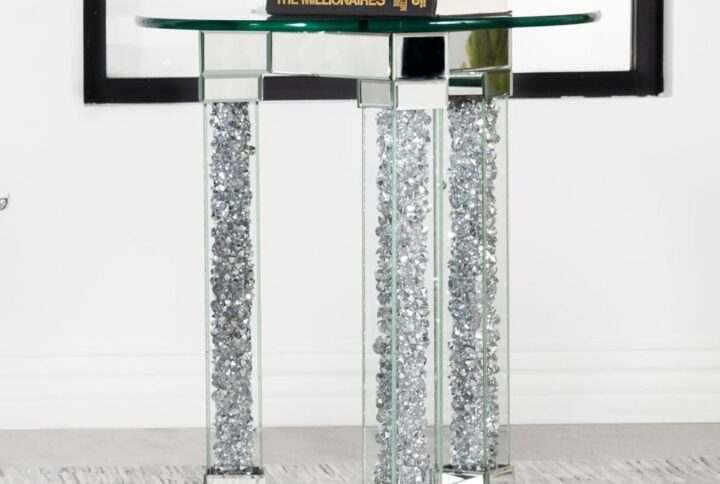 Instantly elevate your living room seating area with this stunning modern glam end table. Silver