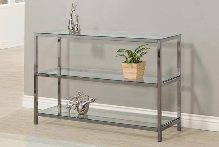 Simple elegance defines the aesthetic of this glass and metal sofa table. Stacked shelving creates a visually pleasing appeal and ample space to arrange and display books