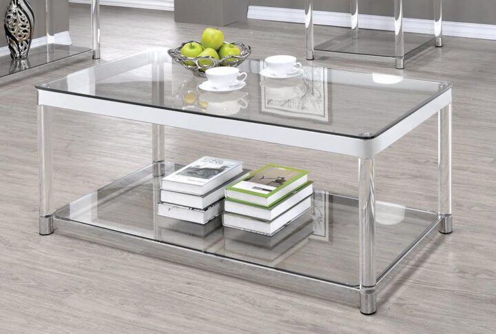 Complete a stylish contemporary space with this glamorous coffee table. Create an elongated look with the sleek and rounded acrylic legs. The top and built-in storage shelf offer ample room for display