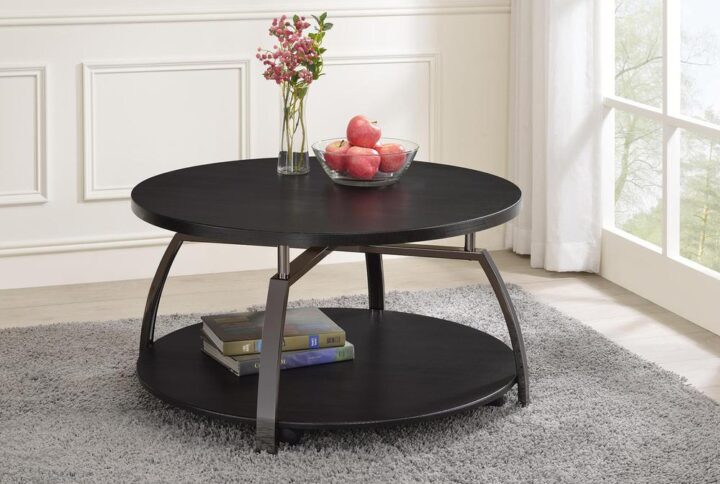 Spark a conversation with this contemporary coffee table in the center of your space. A lovely dark grey finish makes this piece ready to blend with your decor will adding stylish appeal. Supported on a dramatically angled base