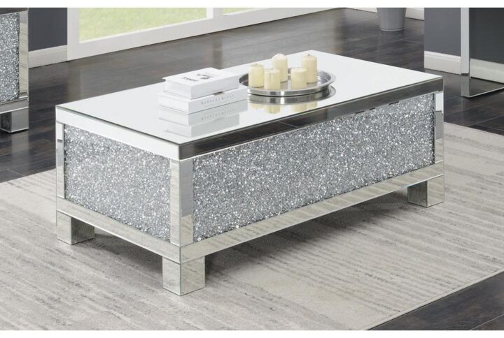 This solidly-constructed silver coffee table fits beautifully in a contemporary living room. Its straight lines show a fresh