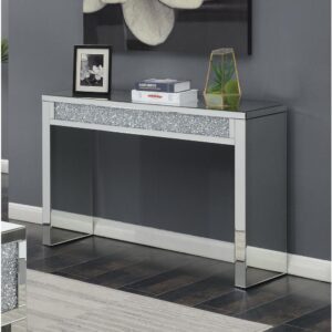 A sofa table is an accent piece that looks good anywhere. This silver sofa table matches well with a modern