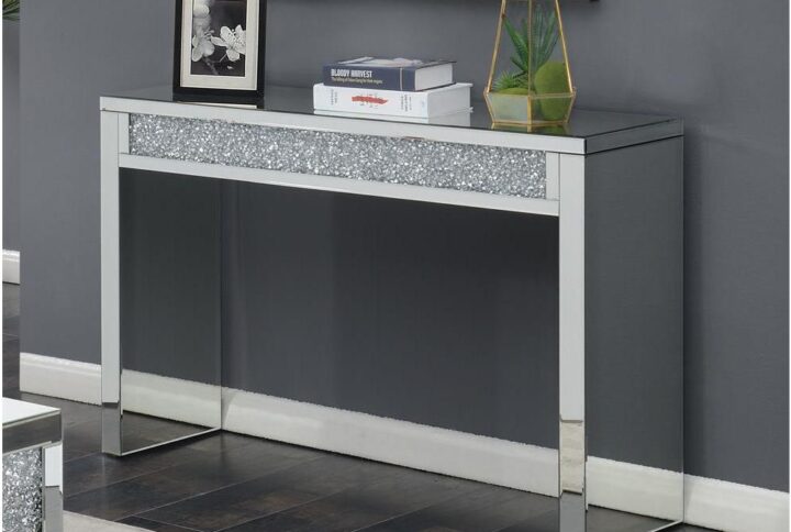 A sofa table is an accent piece that looks good anywhere. This silver sofa table matches well with a modern