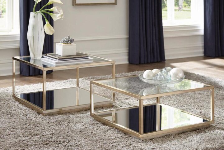 Add this contemporary two-piece occasional table set to your home. Set features both a large and small table that can stand alone or fit beside each other. A rose brass finish frame adds glam and luster to the look. The square table top features crisp